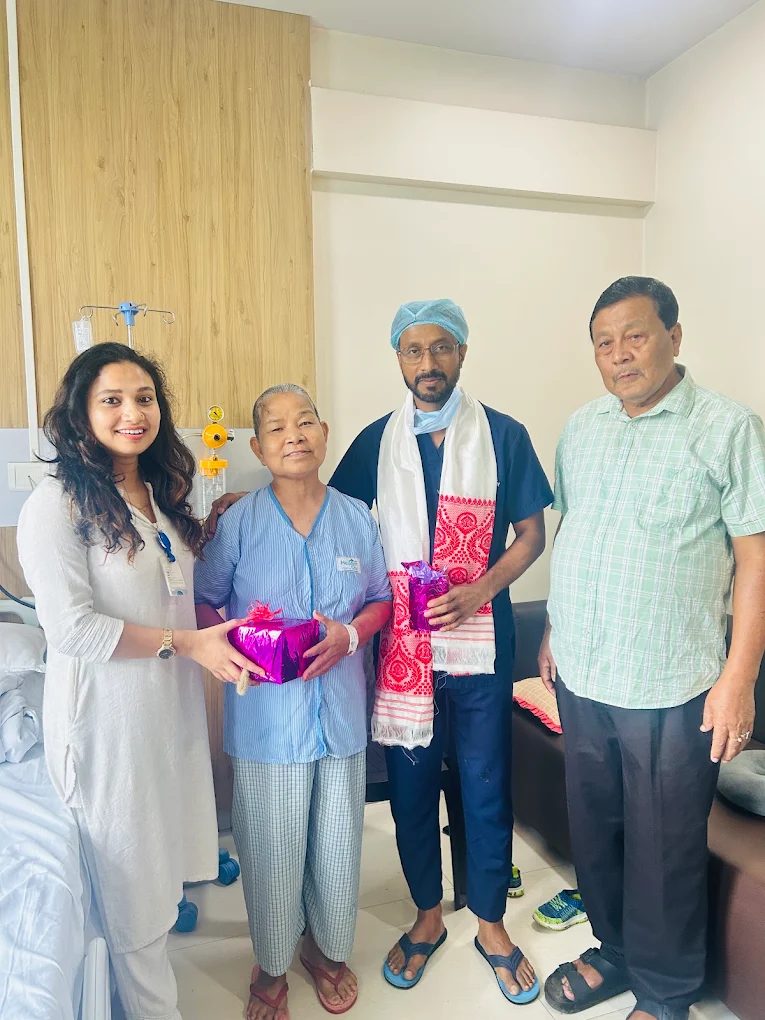 Dr. N.K. Das with a happy patient and family at NENC Hospital